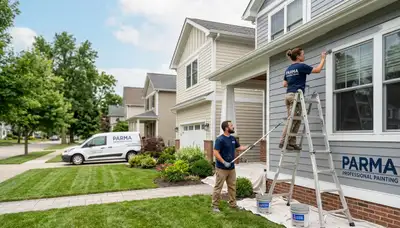 Professional house painters working on residential exterior in Cleveland, OH