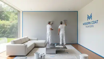 Professional interior house painters finishing a living room wall in Cleveland, OH